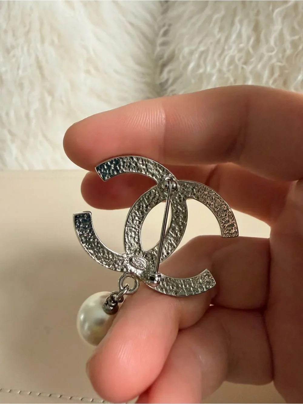 CHANEL brooch showcasing
